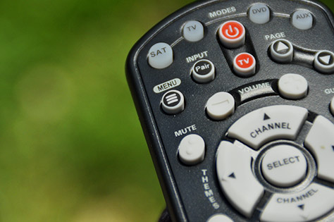 A three-line menu icon on a TV remote control