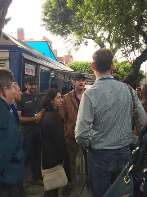 Gathering round the Whisk on Wheels food truck