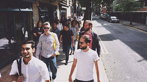 Attendees walking to a lecture in London