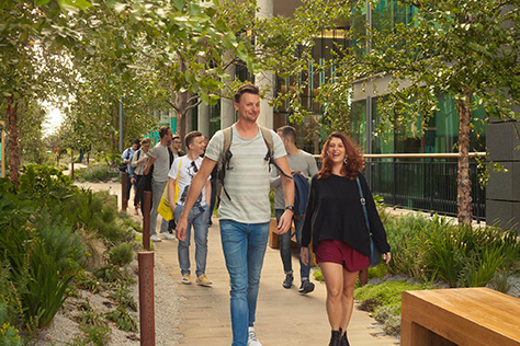 Attendees walking to a lecture in London