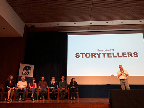 Auditorium with the EUX storytellers on stage